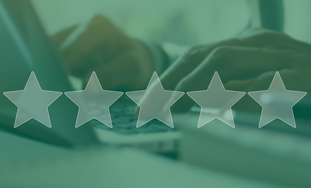 5 star review icons overlaying background of person on laptop